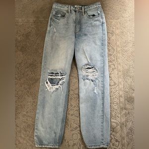 mom jeans light blue denim jeans with rips on the knees